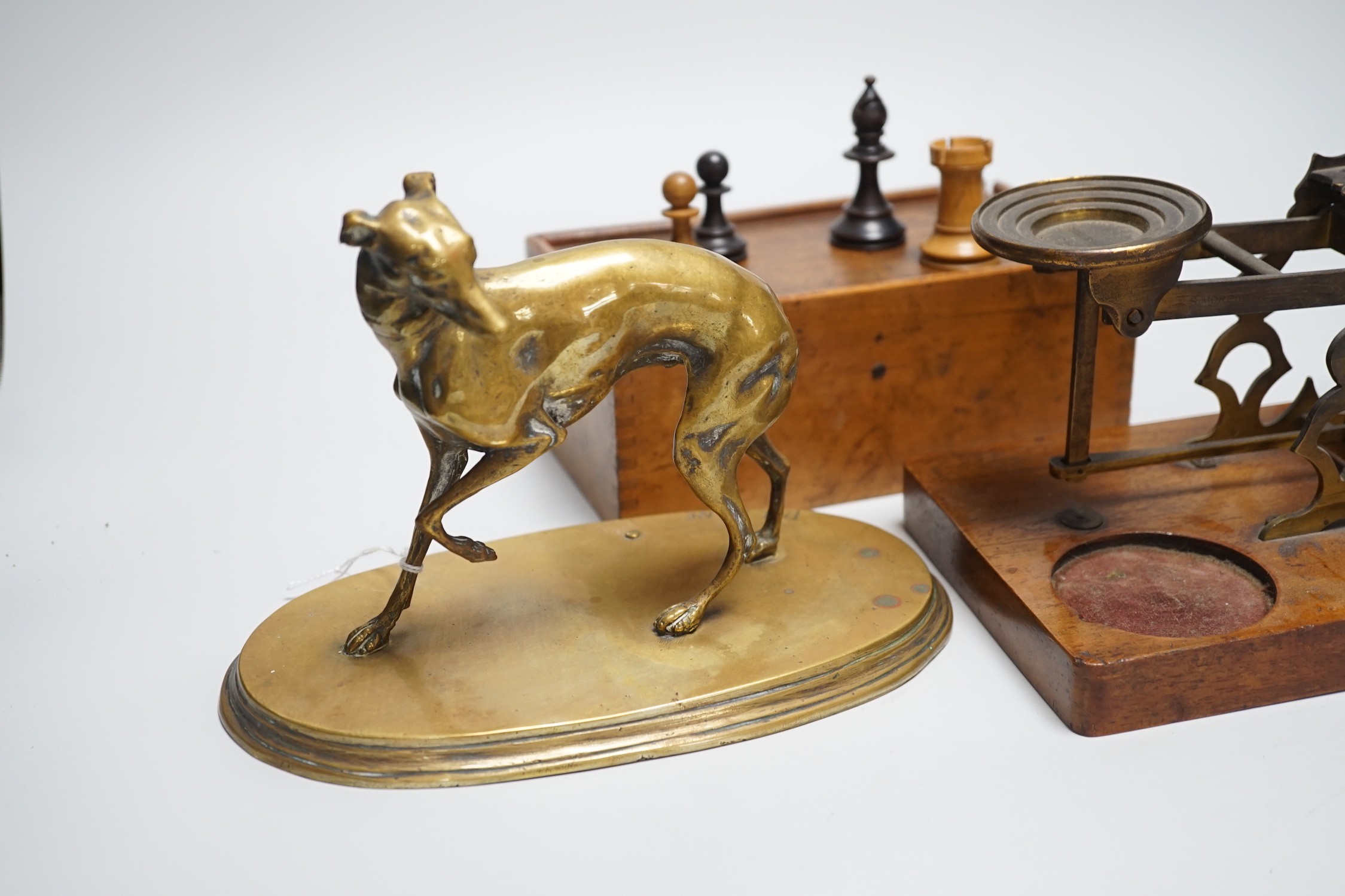 After Mene, a bronze greyhound, a Staunton-pattern chess set and a set of Victorian postal scales, bronze 22cms wide